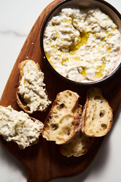 istock Turkish Traditional Eggplant dip with yogurt and garlic. Served on bread 1837282555