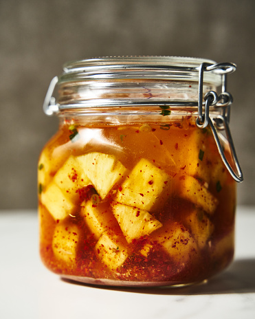 Fermented Pineapple kimchi. With garlic, gochugaru pepper and fish sauce. Pickled pineapple. High quality photo