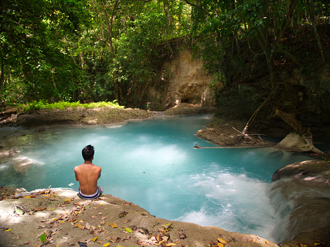 a natural swimming hole with blue waters