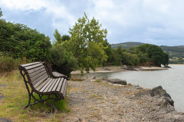 istock landscape with wooden bench 1837290429