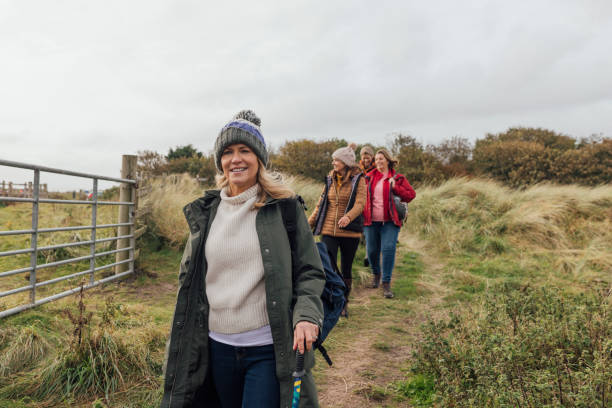 istock Women Wandering Amidst Sand Dunes 1837328162