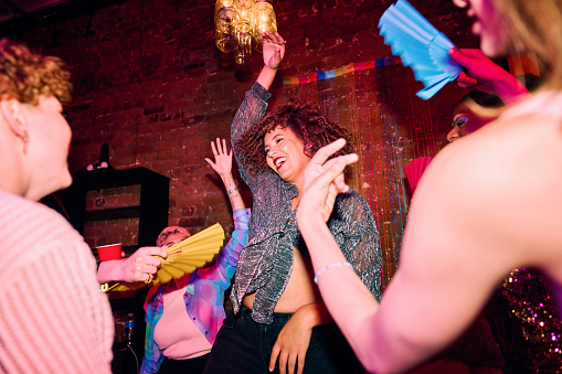 Diverse Group of LGBTQIA Friends Celebrating at a Party