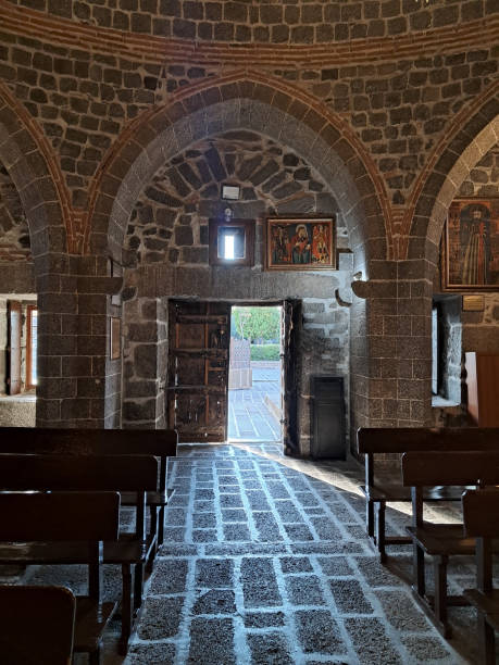 istock Church interior with stone wall and pews 1837336278