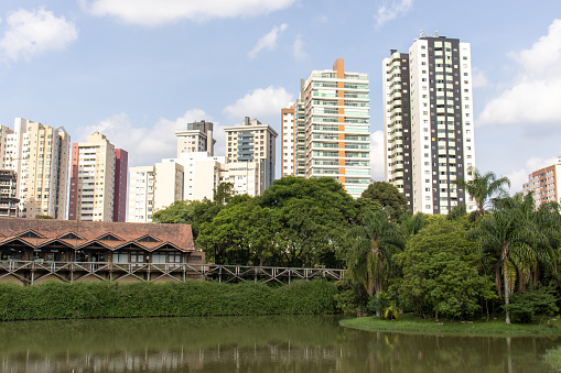 Buildings and lake seen from the Jardim Botânico of Curitiba postcard of the city Paraná Brazil