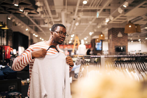 istock Young black man at shopping 1837372835