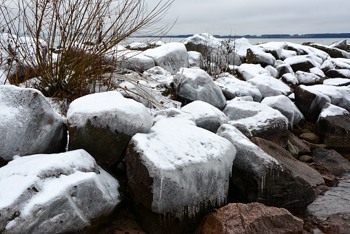 Frozen harbour on the edge of Lake Vättern at Röttle By near Gränna, Sweden.