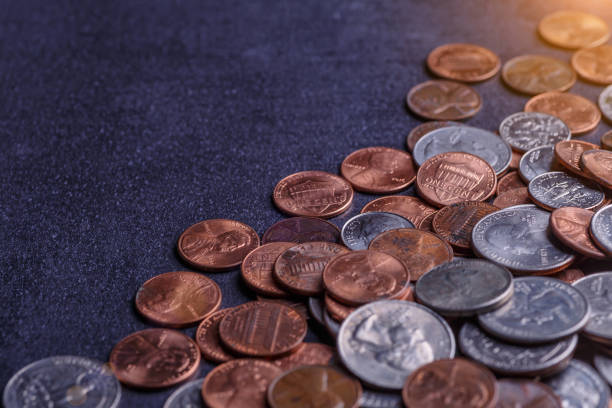 istock American coins and us dollars on a black table 1837405175