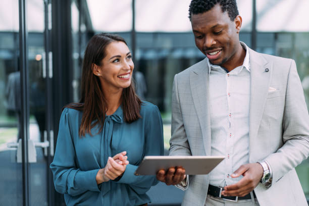 istock Business people using digital tablet outdoors. 1837426294