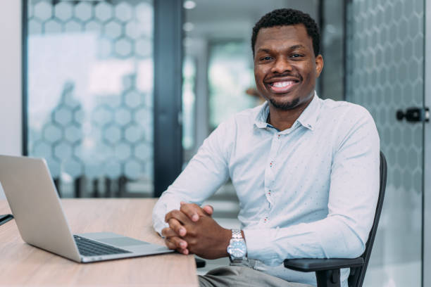 istock Successful businessman in modern office working on laptop. 1837428946