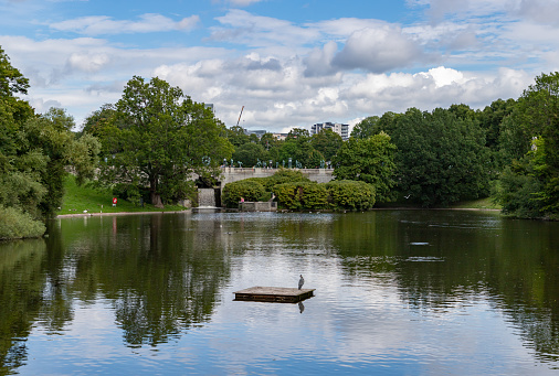 A picture of the lake and bridge at the Vigeland or Frogner Park.