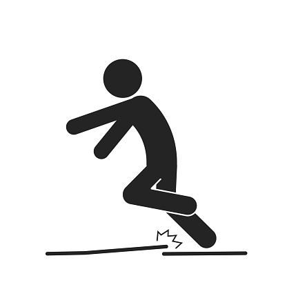 Isolated black pictogram sign of injury, accident, man tripped, uneven surface for industrial safety sign