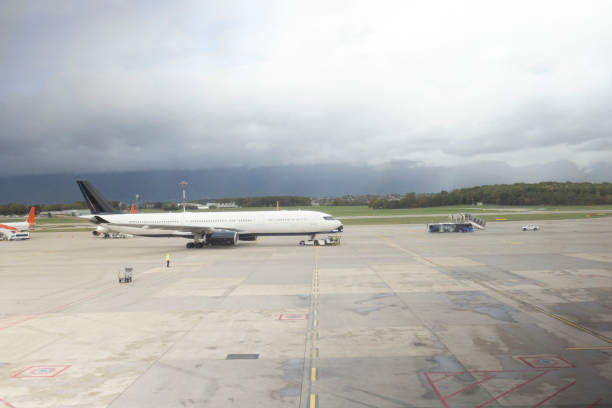 Side view of an airplane on the airport runway preparing for take off
