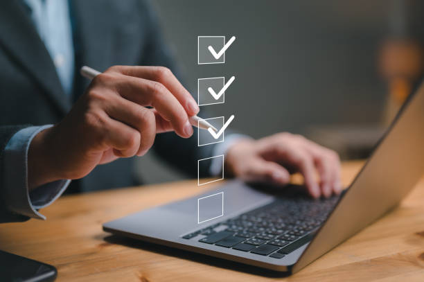 istock Business performance checklist, businessman using laptop doing online checklist survey, filling out digital form checklist, take an assessment, questionnaire, evaluation, online survey, online exam. 1837496334