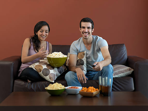 istock Friends hanging out and watching TV 183750378