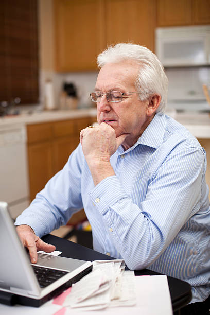 istock Senior Business Man Preparing Taxes 183750544