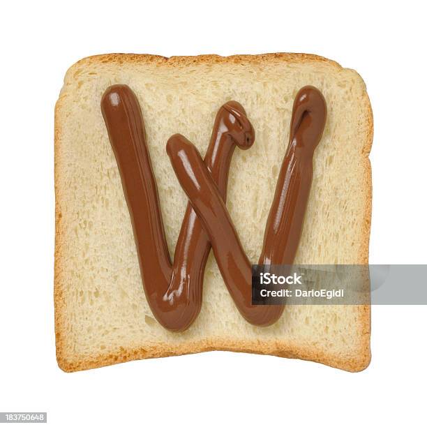 Chocolate Letter W On A Tinloaf Slice White Background Stock Photo - Download Image Now