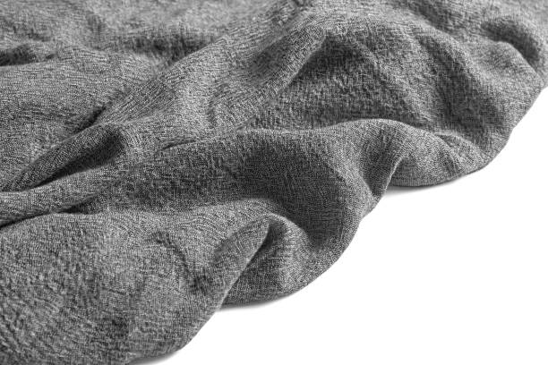 istock Gray linen napkin carelessly laid out isolated on a white background. Selective focus 1837507842