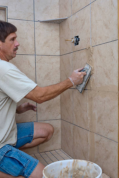istock Applying Grout to New Bathroom Shower Tile 183750904