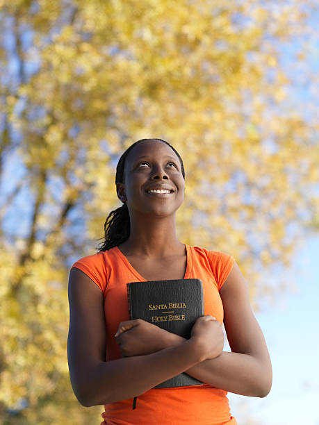 istock Christian woman embracing a bible 183750907