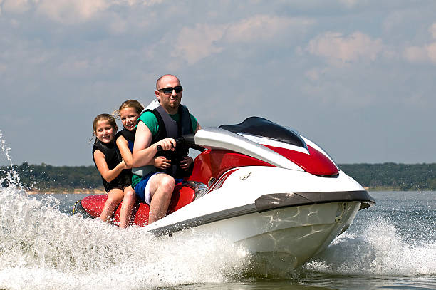 istock Riding on personal water craft 183750989
