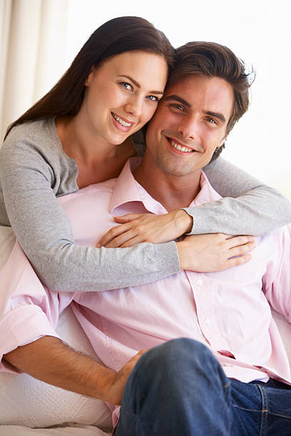 istock Young Couple Relaxing On Sofa Together At Home 183751166