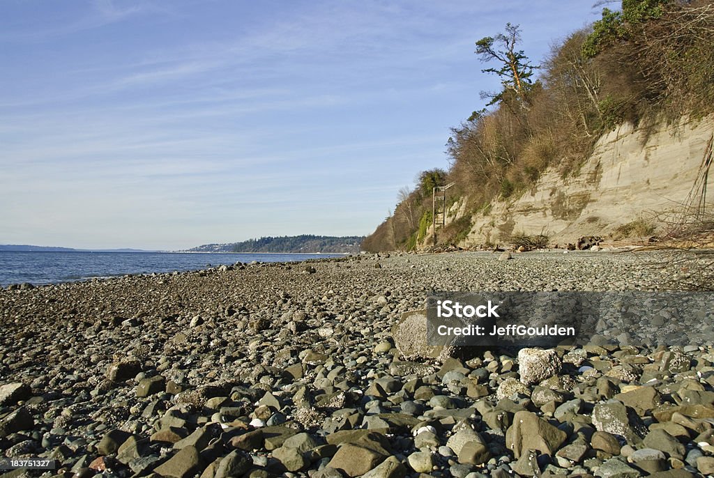 Rocky Beach on Puget Sound The landscapes and seascapes of Puget Sound are a constant source of inspiration for photographers. This picture of a rocky beach was photographed from Saltwater State Park near Des Moines, Washington State, USA. Beach Stock Photo