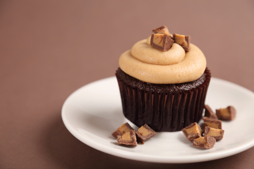 XXXL.  Single delicious peanut butter cupcake with peanut butter cup chunks.