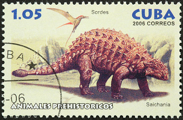 istock flying sordes, and spiked saichania dinosaurs 183752014