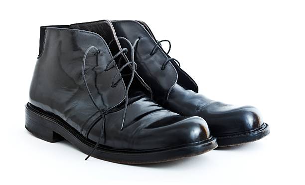 istock Business man black leather shoes on white 183752043
