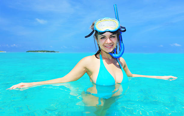 istock Female diver with raised mask looking at camera. 183754376