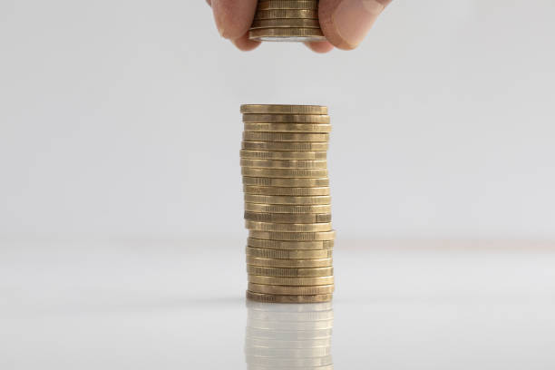 istock Man's Hand Put Money Coins To Stack of Coins 1837544775