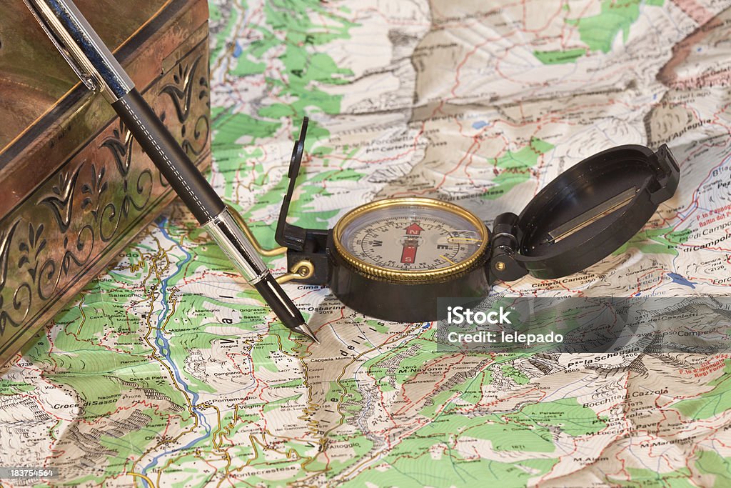 Planning a trip Compass and pen over road map Cartography Stock Photo