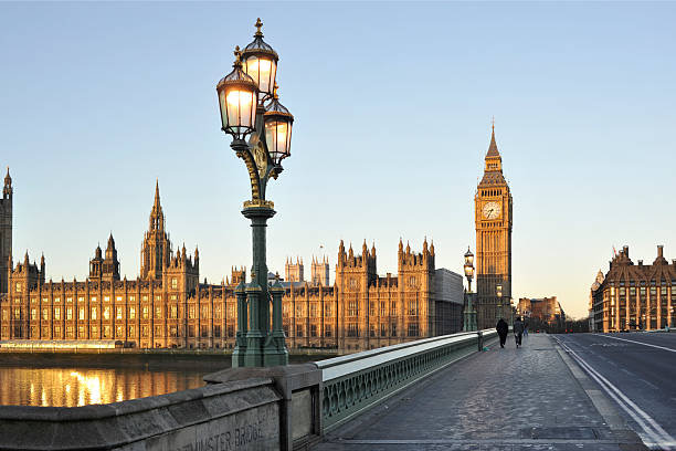 Bridge beside the Houses of Parliament, London, England The houses of parliament and Westminster bridge in central London bathed in the early morning sunlight, No filters were used on this file. westminster bridge stock pictures, royalty-free photos & images