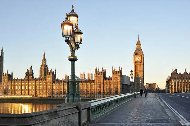 The houses of parliament and Westminster bridge in central London bathed in the early morning sunlight, No filters were used on this file.