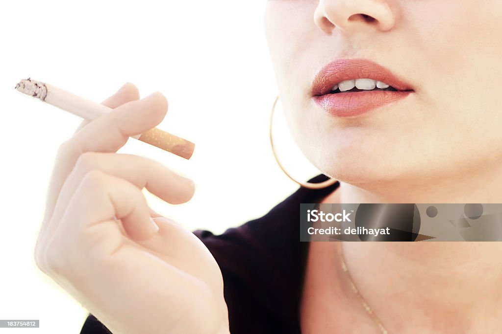 Smoking Woman inhales smokes from a cigarette Addiction Stock Photo