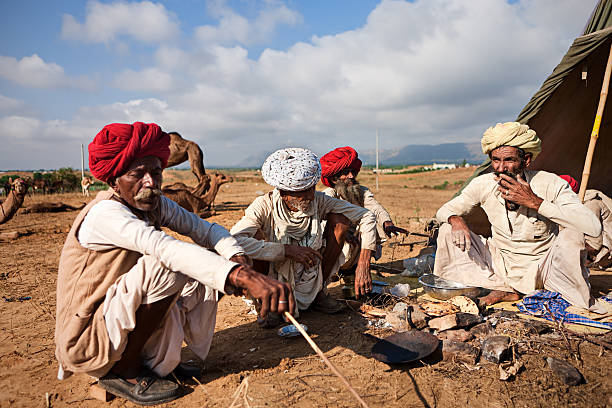 istock Indian men preparing chapatti bread during festival in Pushkar 183754825