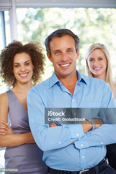 Business Man With His Supporting Team Stock Photo - Download Image Now - 40-49 Years, Adult, Adults Only