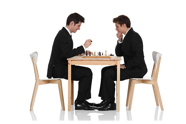 Young businessmen playing chesshttp://www.twodozendesign.info/i/1.png