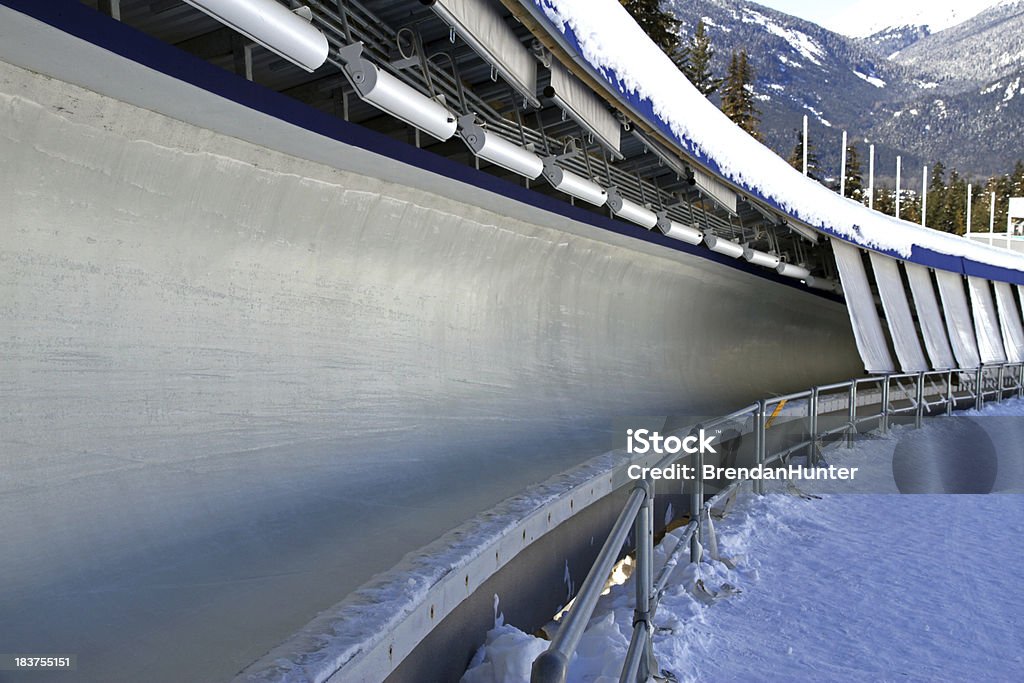 Sled Track "The Whistler Sliding Centre track in winter. The track is outfitted for bobsleigh, luge, and skeleton and is located in Whistler, British Columbia. It was designed for the 2010 winter Olympics." Bobsled Stock Photo