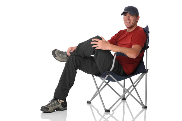 Isolated casual man sitting in camping chair Isolated casual man sitting in camping chairhttp://www.twodozendesign.info/i/1.png folding chair stock pictures, royalty-free photos & images