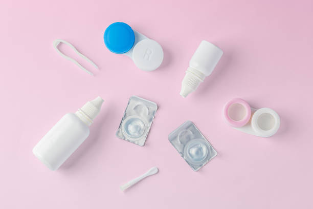 istock Contact lenses with container, solution bottle and accessories on pink background 1837558845