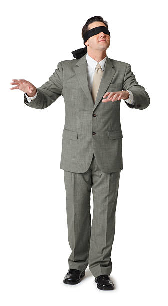 istock Blindfolded businessman extending hands isolated on white 183756851