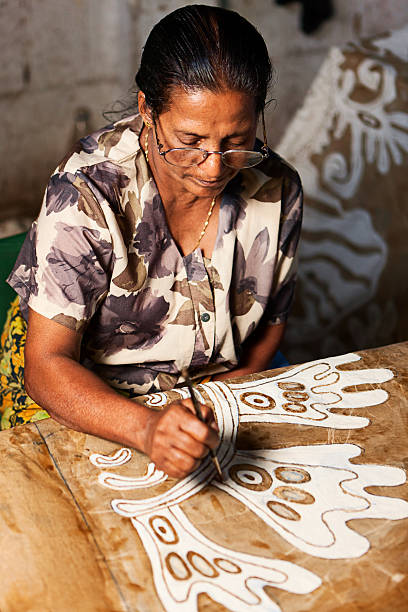 istock Sri Lankan woman making batik near Kandy 183756914