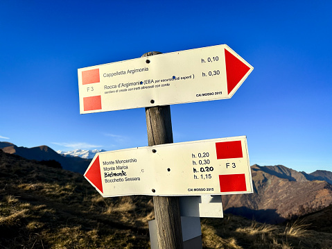 Signposts of trekking walklines of the mountains of Valdilana (Biella Province, Piemonte Region, Northern Italy), during wintertime.