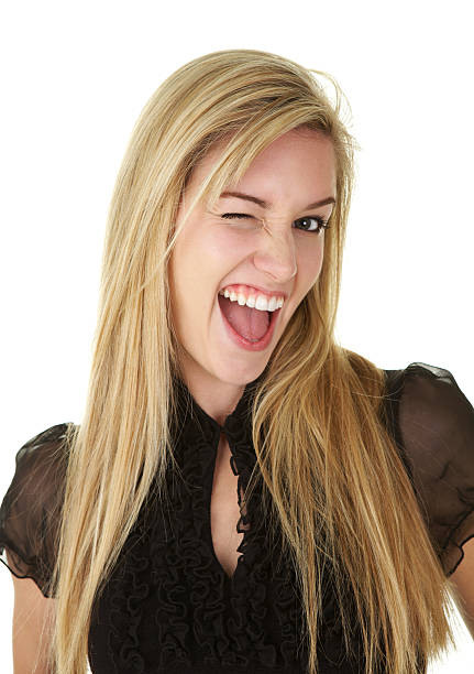 istock Beautiful Young Blond Woman with Funny Expression WInking on White 183757077