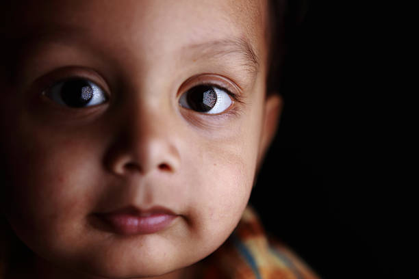 istock Closeup Portrait 2 year old Indian Boy with interesting catch-light 183757522