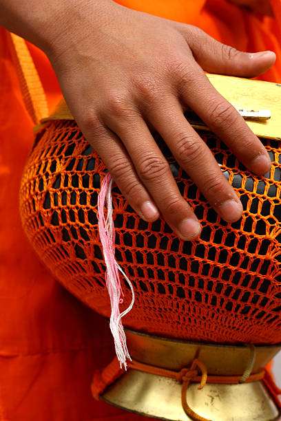 istock Hand of a Buddhist monk with offering 183757569