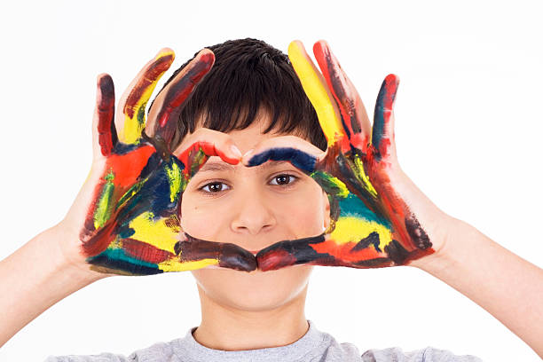 istock boy with hands painted in colorful paints 183757584