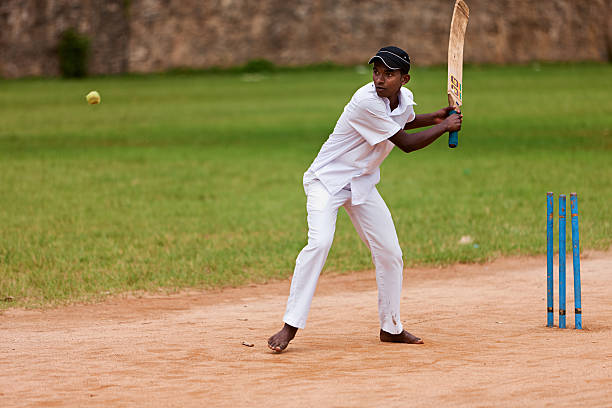 istock Young Sri Lankan schoolboys playing cricket 183757714