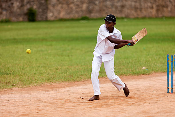 istock Young Sri Lankan schoolboys playing cricket 183759742